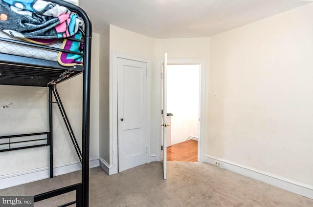 unfurnished bedroom with light carpet