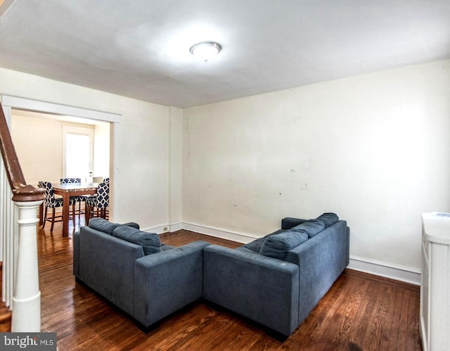 living room with dark wood-type flooring