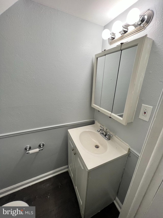 bathroom featuring vanity and hardwood / wood-style flooring