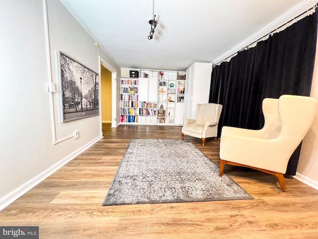 living area with hardwood / wood-style flooring