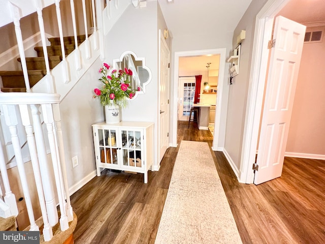 hall with dark hardwood / wood-style floors