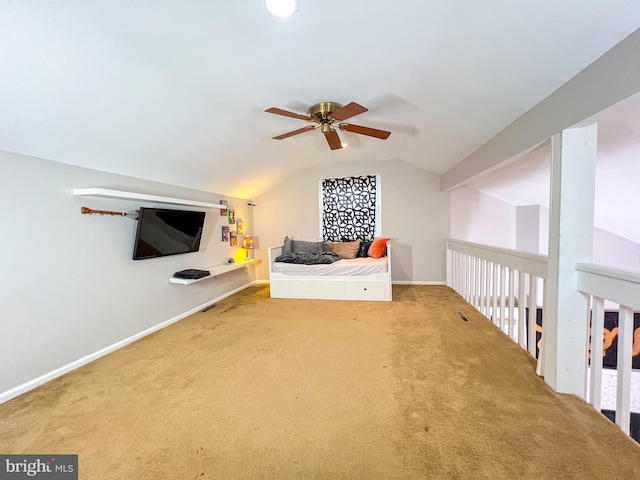 additional living space featuring vaulted ceiling, carpet flooring, and ceiling fan