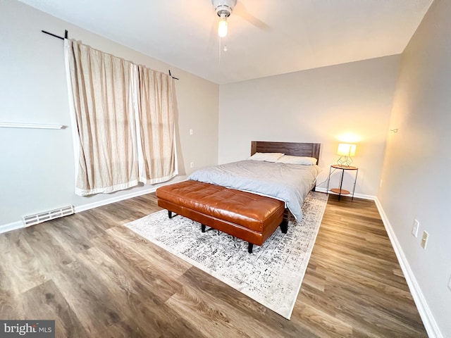 bedroom featuring hardwood / wood-style floors and ceiling fan