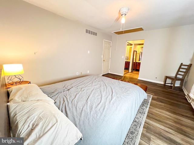 bedroom featuring wood-type flooring and ensuite bathroom