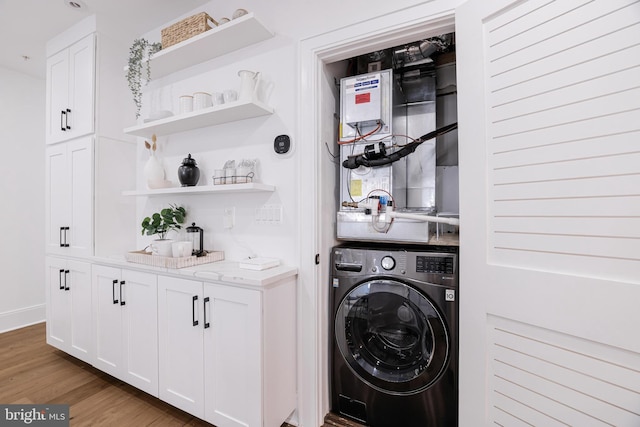 laundry area with washer / clothes dryer and wood-type flooring