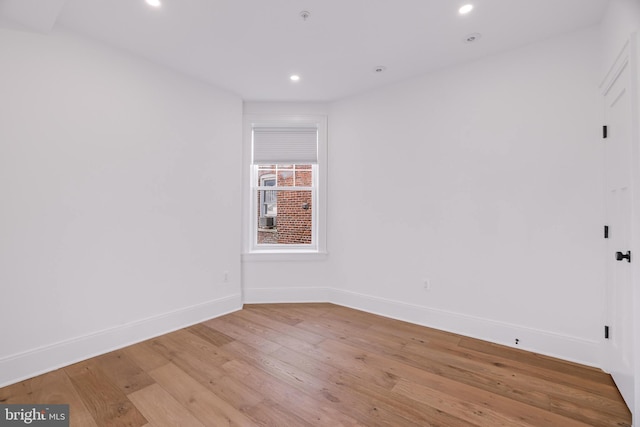 unfurnished room featuring light hardwood / wood-style flooring