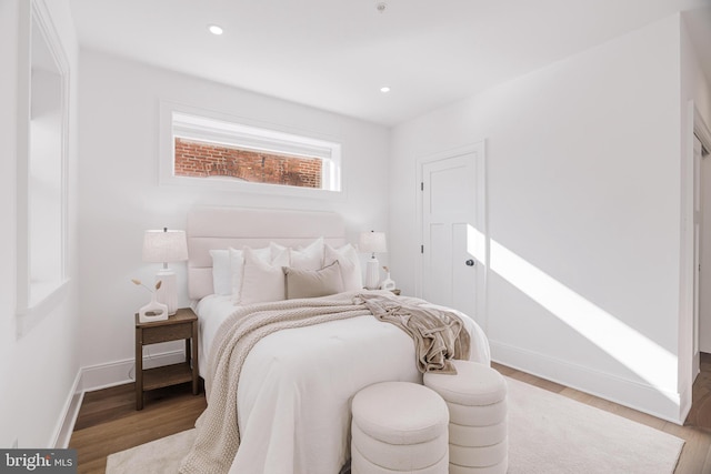 bedroom featuring wood-type flooring