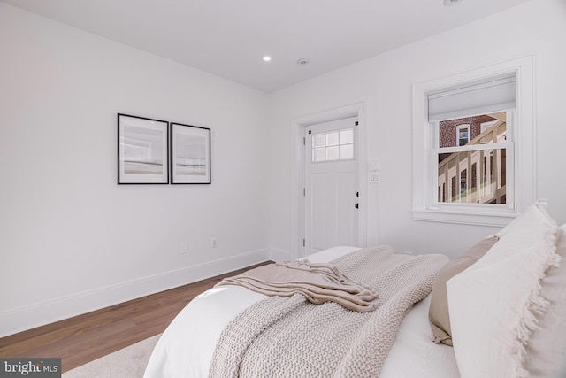 bedroom with hardwood / wood-style floors