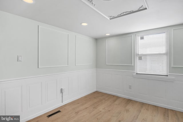 unfurnished room featuring light hardwood / wood-style flooring