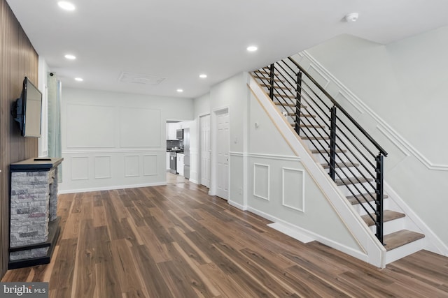 unfurnished living room featuring dark wood-type flooring