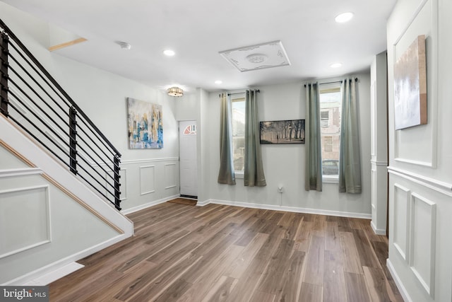 foyer entrance with hardwood / wood-style floors