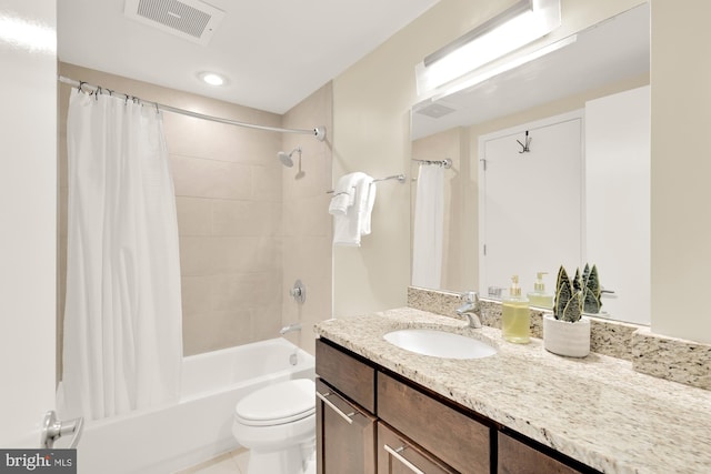 full bathroom featuring vanity, shower / tub combo, and toilet