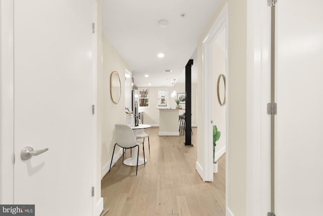 hallway featuring light hardwood / wood-style floors