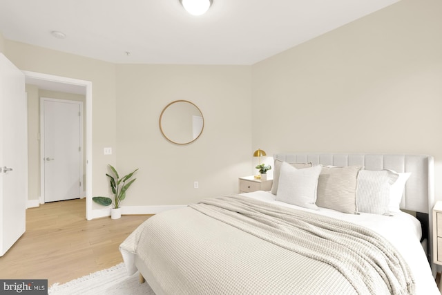 bedroom with light hardwood / wood-style flooring