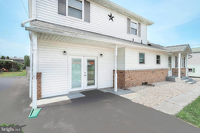 back of property with french doors