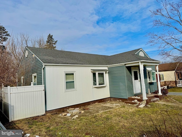 view of side of home featuring a lawn