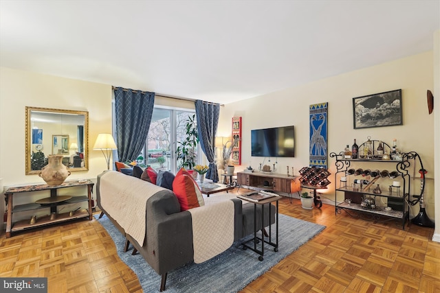 living room featuring parquet floors