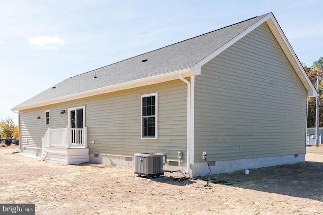 back of property featuring central AC unit