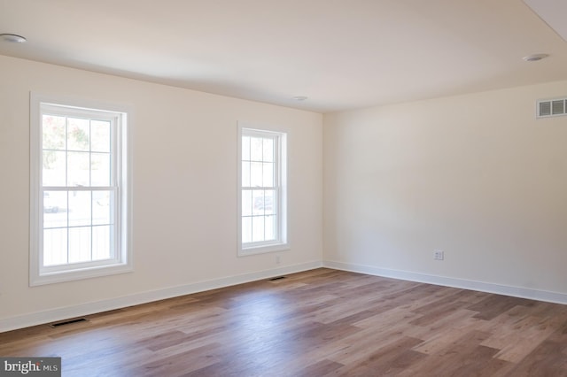 unfurnished room featuring light hardwood / wood-style flooring