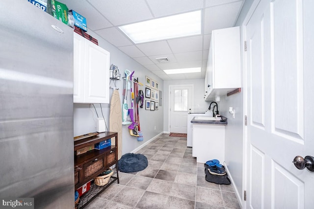 clothes washing area featuring sink