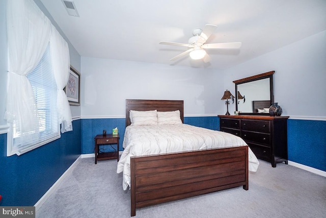 bedroom with light carpet and ceiling fan