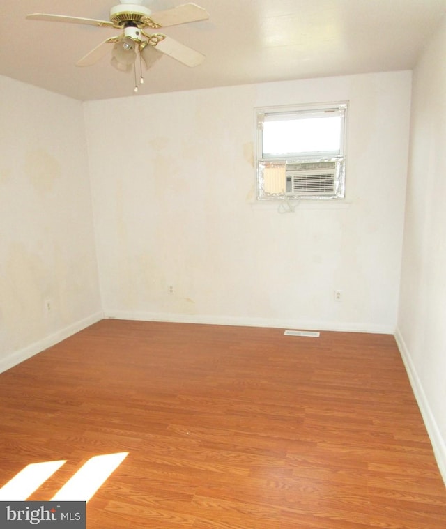 unfurnished room featuring ceiling fan and light hardwood / wood-style flooring