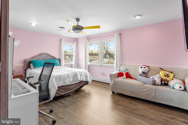 bedroom featuring dark wood-type flooring and ceiling fan