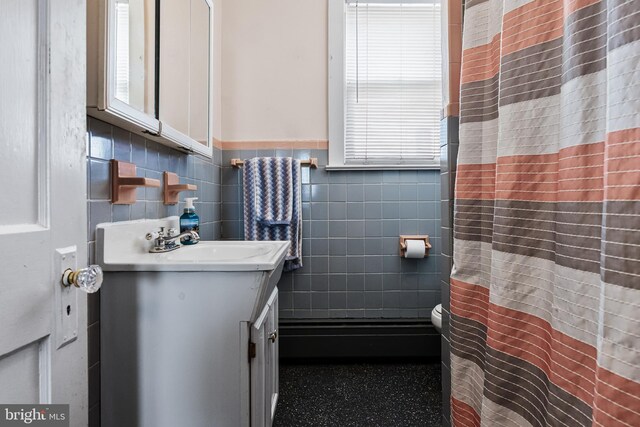 910 Woodland Ave, Burlington, NJ 08016 - bathroom with vanity, tile walls, and a wealth of natural light