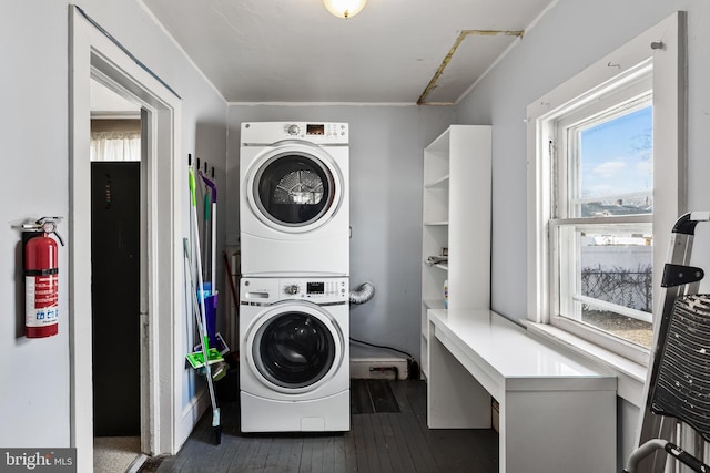 910 Woodland Ave, Burlington, NJ 08016 - clothes washing area featuring stacked washer and clothes dryer and dark hardwood / wood-style flooring