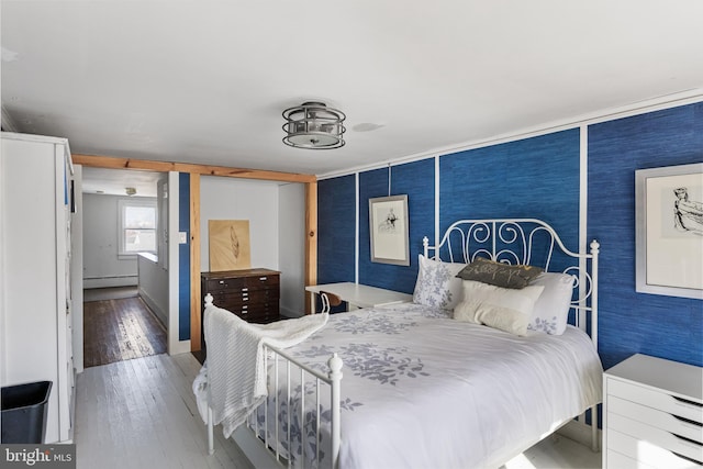 910 Woodland Ave, Burlington, NJ 08016 - bedroom with baseboard heating and wood-type flooring