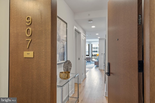 hall with light hardwood / wood-style flooring