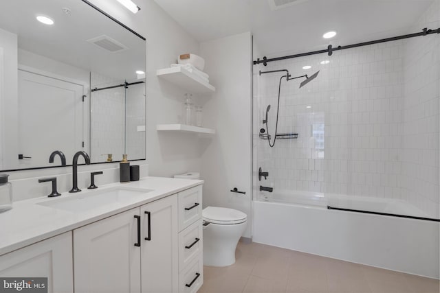 full bathroom with toilet, vanity, bath / shower combo with glass door, and tile patterned flooring