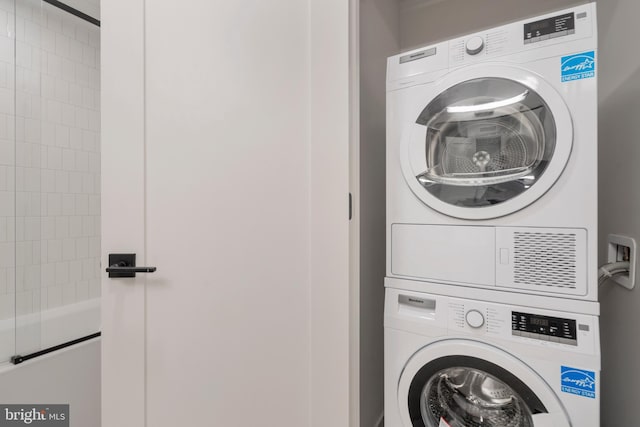 laundry area with stacked washer / drying machine