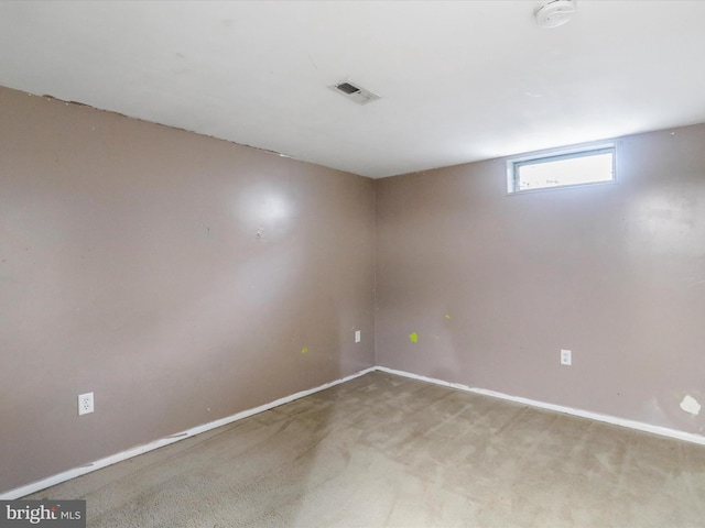 basement featuring light colored carpet