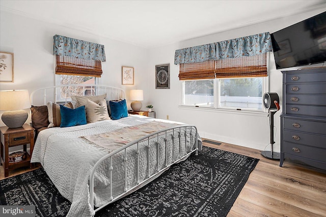 bedroom with wood-type flooring