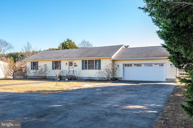 single story home featuring a garage