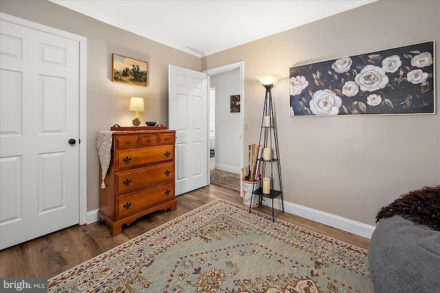 interior space with ornamental molding and dark hardwood / wood-style flooring