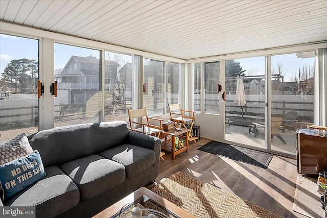 sunroom / solarium featuring a healthy amount of sunlight