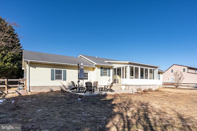 back of house with a patio and a sunroom