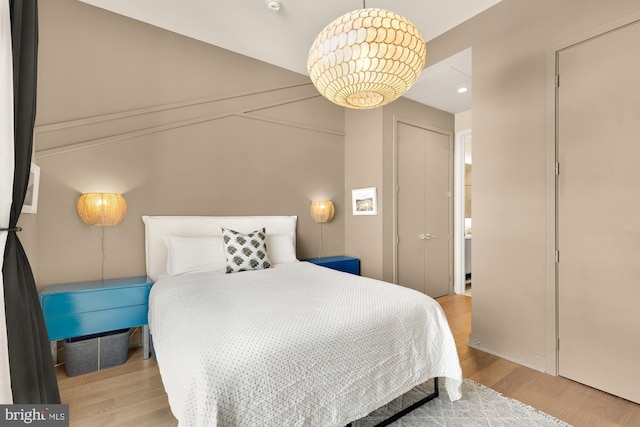 bedroom with light wood-type flooring