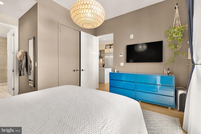 bedroom with a closet and light wood-type flooring