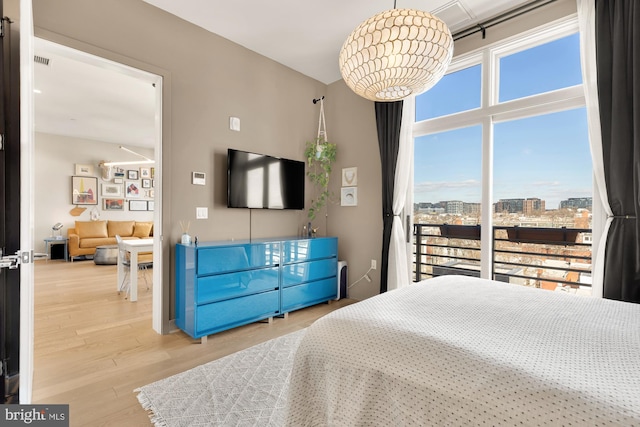 bedroom with hardwood / wood-style flooring