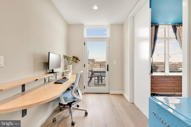 office with light wood-type flooring