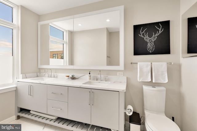 bathroom featuring vanity and toilet