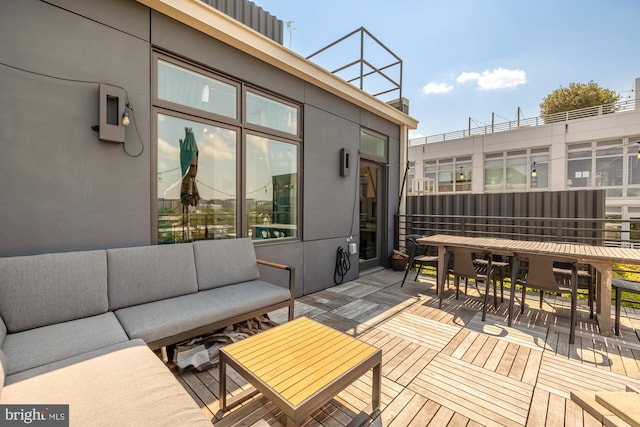 wooden deck featuring an outdoor hangout area