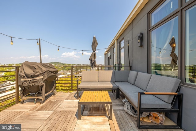 wooden terrace featuring grilling area and outdoor lounge area