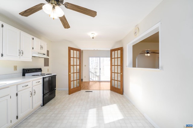 kitchen featuring french doors, white cabinets, ceiling fan, and black / electric stove