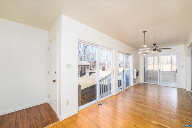 spare room with hardwood / wood-style flooring and ceiling fan