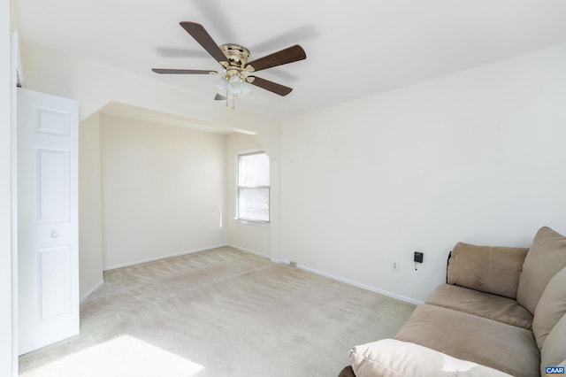 living room with light carpet and ceiling fan