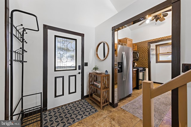 entrance foyer with ceiling fan